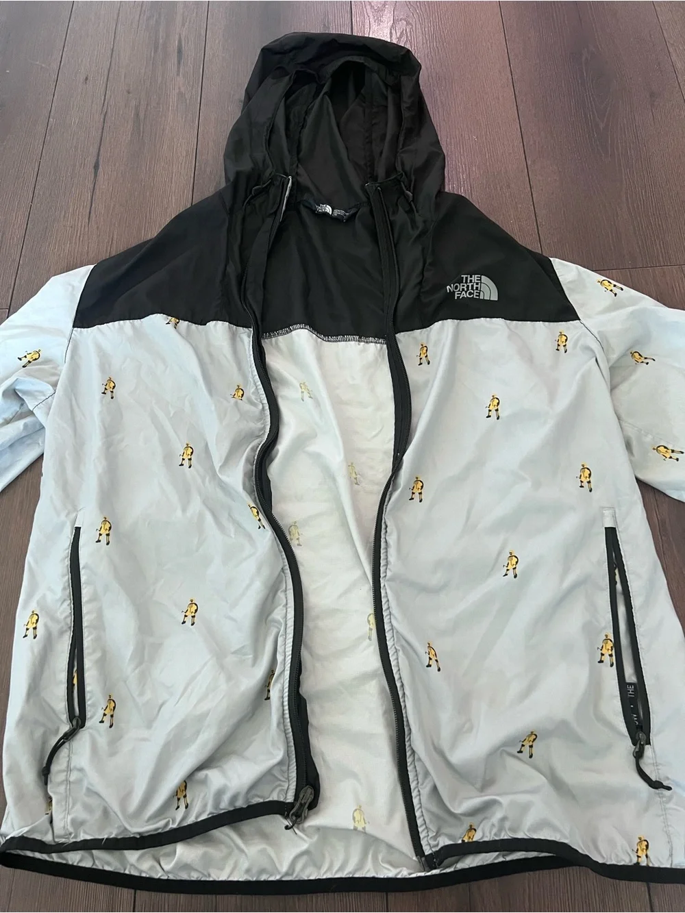 The North Face Black & Light Gray Hooded Windbreaker with Yellow Motif